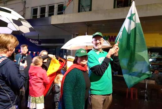Wanda and Jonathan marching with the Esperanto flag